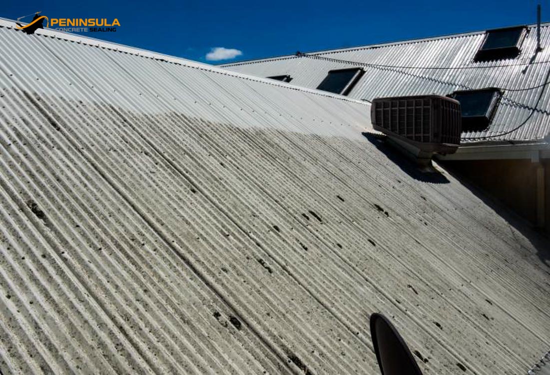 An exterior roof having been hit with pressure cleaning services