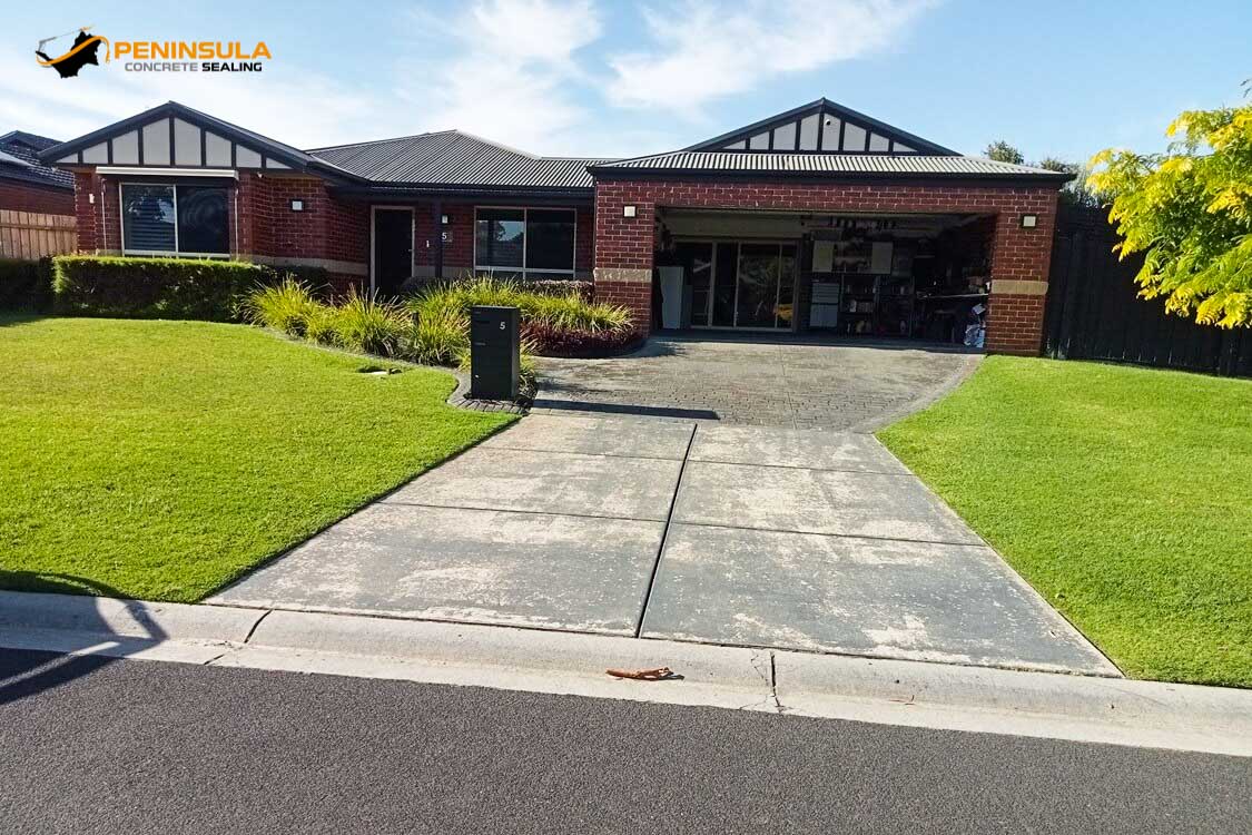 Driveway with failed flaking coating before repair