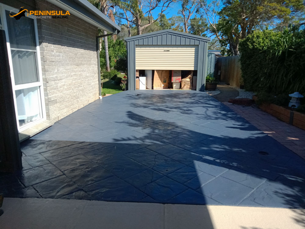 Stamped concrete driveway after sealing and painting