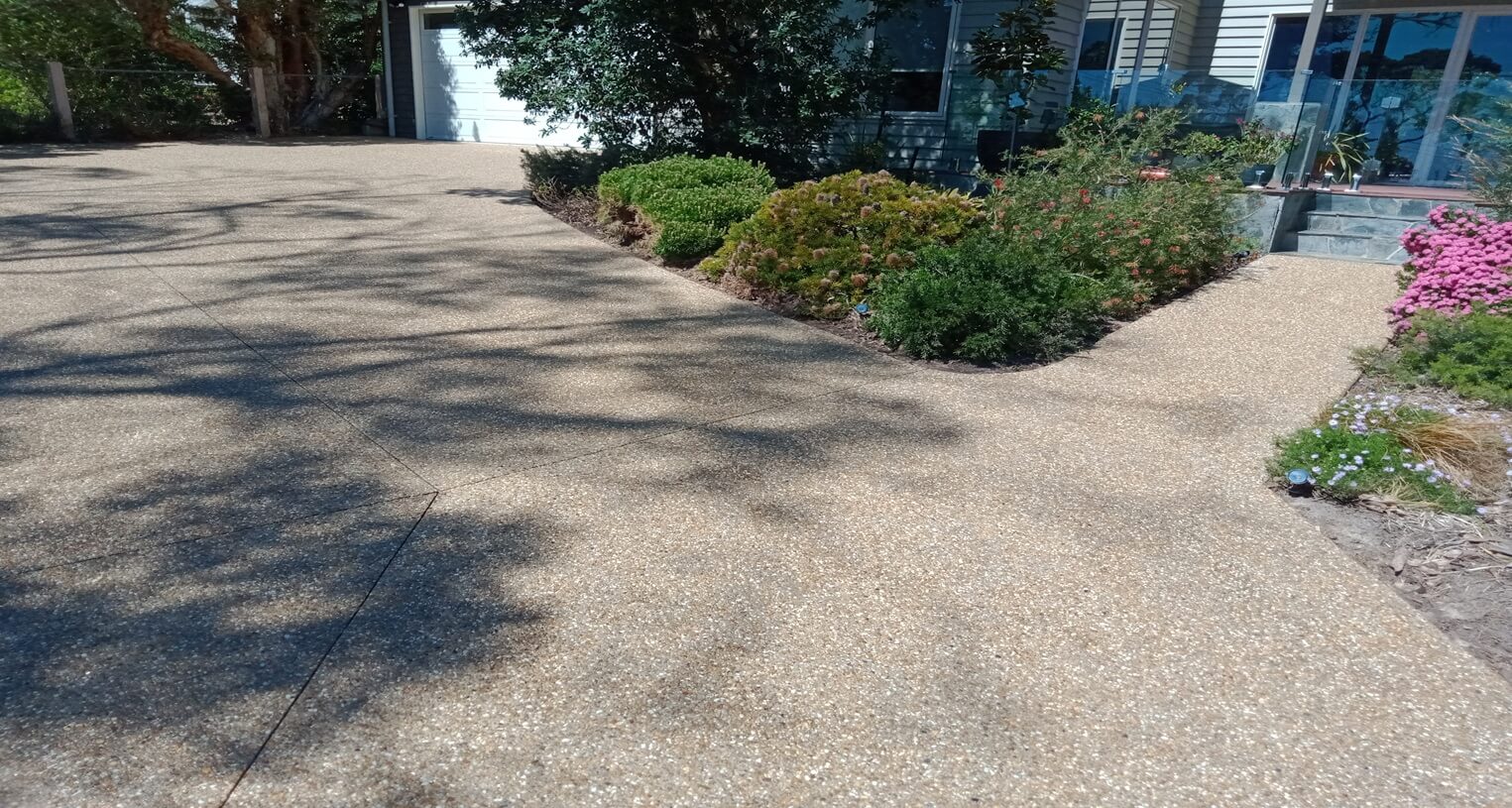 Tan exposed aggregate driveway after sealing in Mt Martha