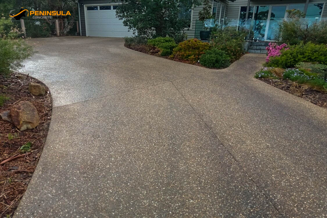 An old exposed aggregate surface before driveway cleaning